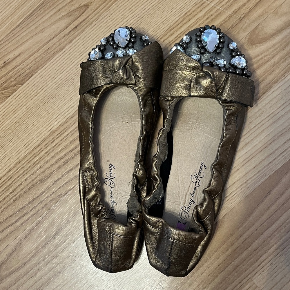Soft flats (8) in copper leather with giant rhinestone accents.